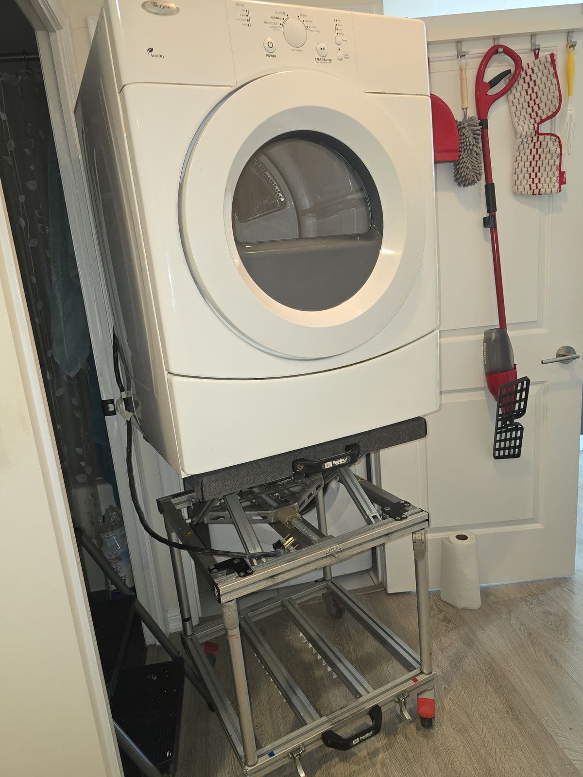 Dryer on an appliance lift during an in-home installation